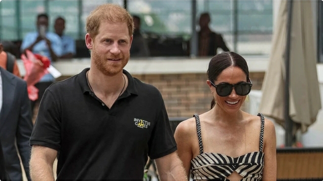 Meghan Markle stuns in thigh-split silk dress for day two of Nigeria trip