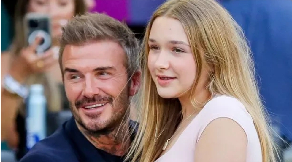 David Beckham cuddles daughter Harper as they share sweet moment at football match