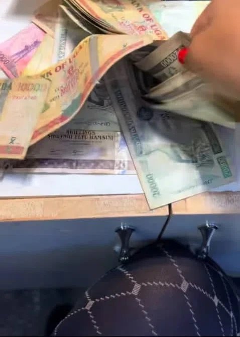 Ugandan woman opens late grandfather’s inheritance to find stash of old demonetised banknotes